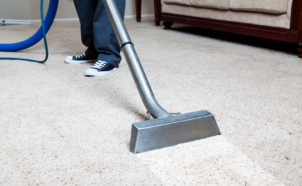 Carpet Cleaning "Man cleaning carpet in homeTo see more CARPET, SOFA & TILE CLEANING Photos, please click on banner below."